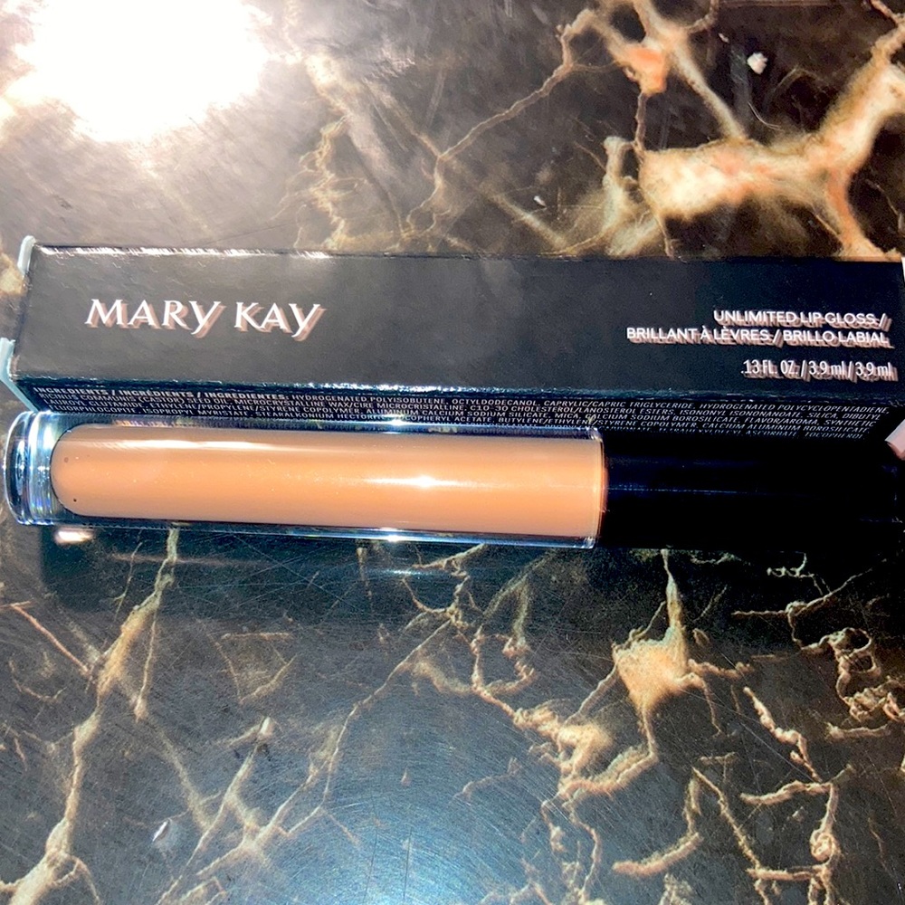 Brand new lip gloss in soft nude unlimited lip gloss never open .